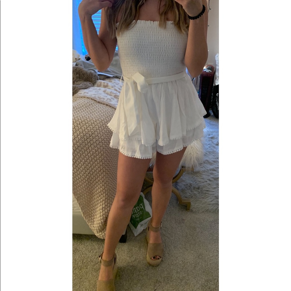 These three boutique white romper